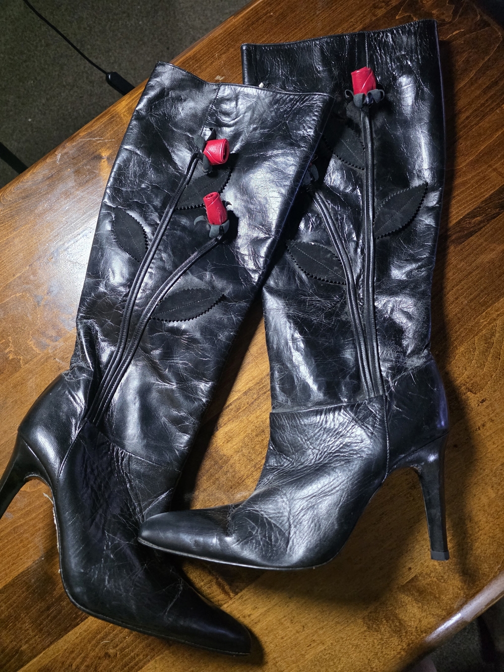 Black Leather Knee-High Boots with Red Rose Accent